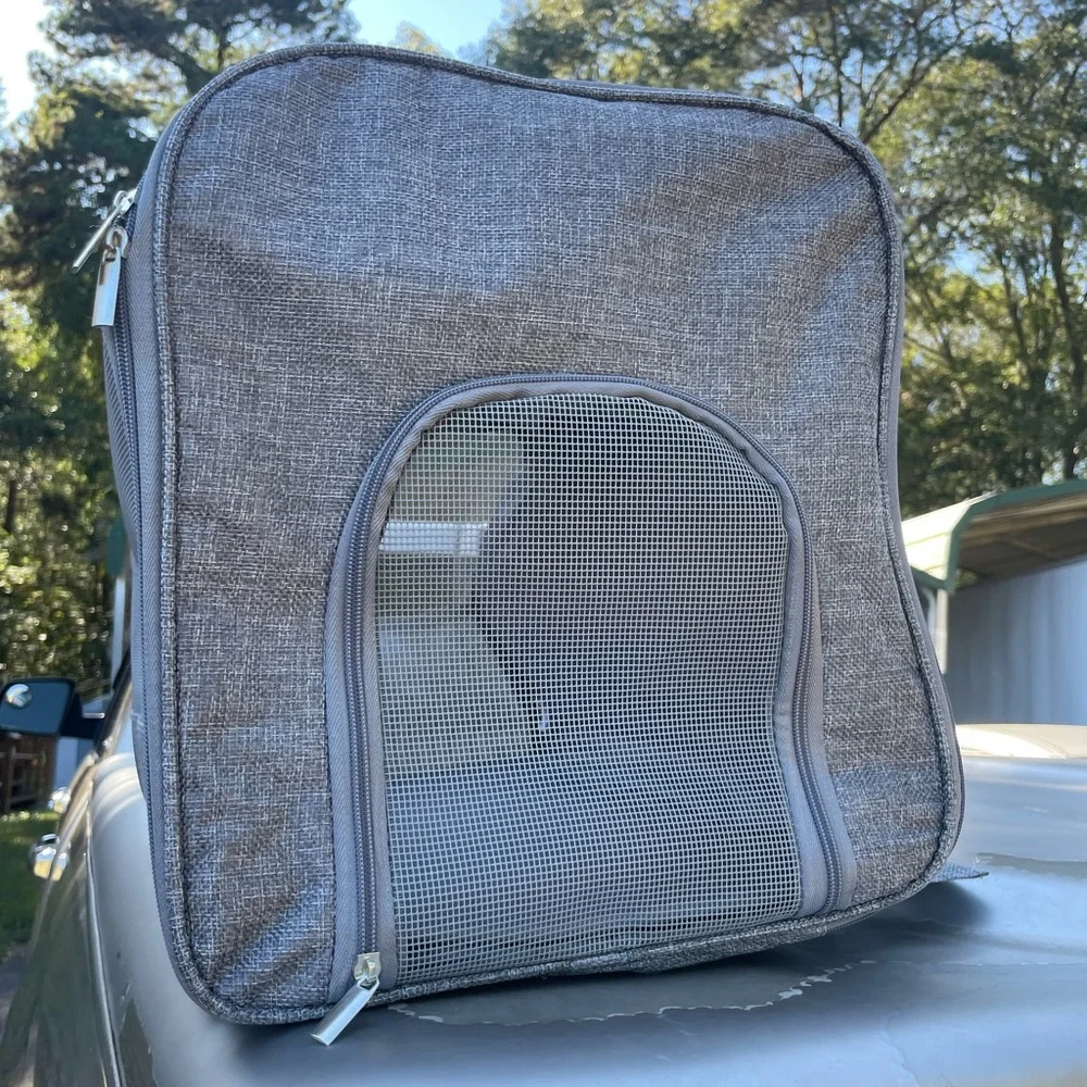 A pet travel carrier and roller. 2 doors on each side. Detachable roller base.